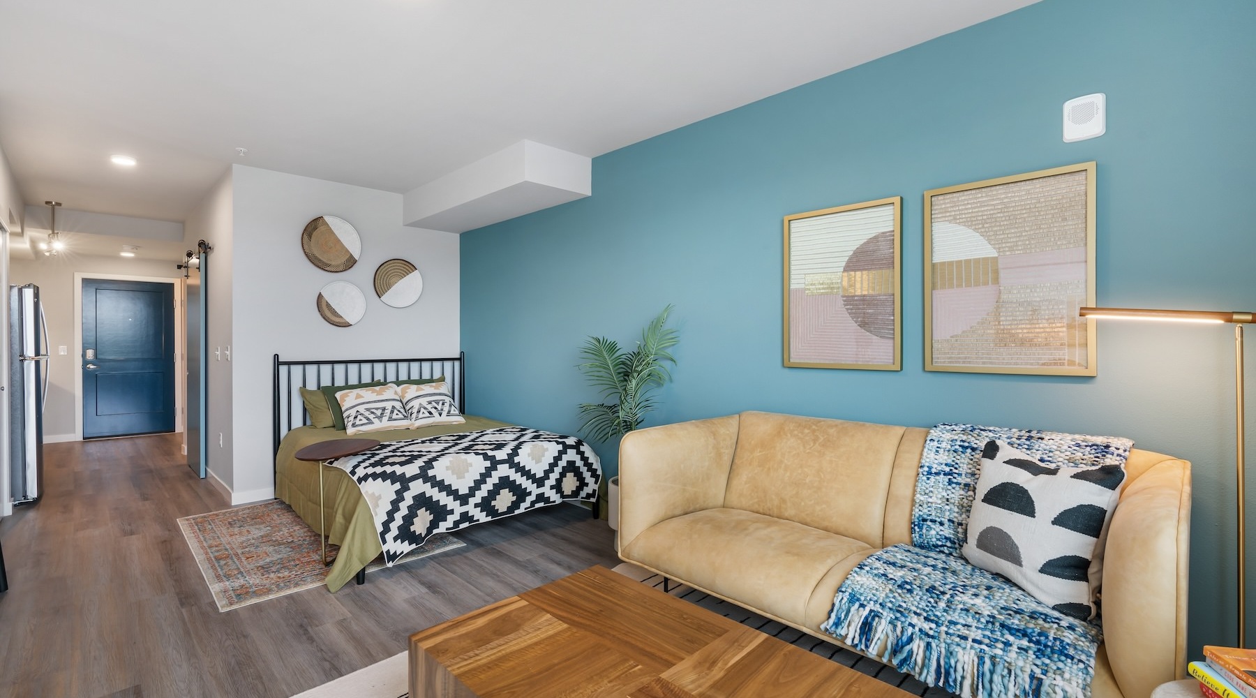 a living room with a couch and a bed