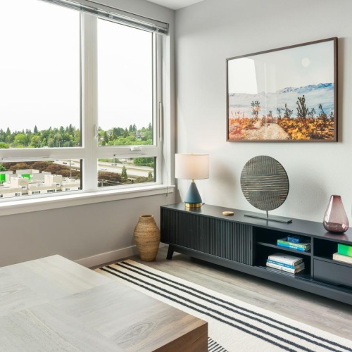 a living room with a tv and a table